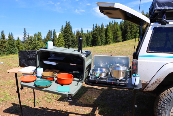 A silver truck is shown with Yakima EXO SwingBased OpenRange Deluxe Kitchen with Gerber plates and bowls