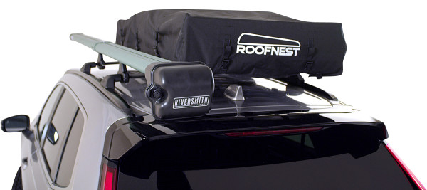 Meadowlark XL Roofnest car-top tent is shown packed into its black transport case on top of an SUV roof rack